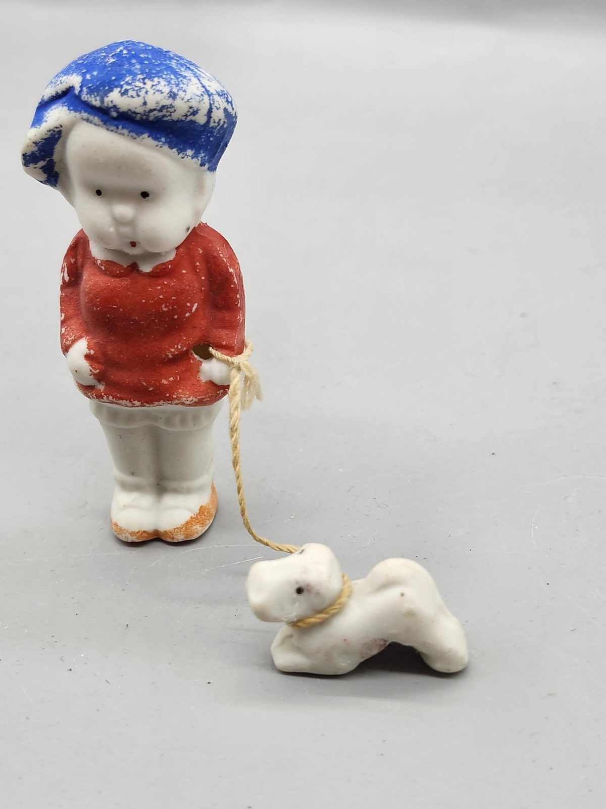Vintage Child With Dog Porcelain Figurine Small Red Blue Hand Painted Decor