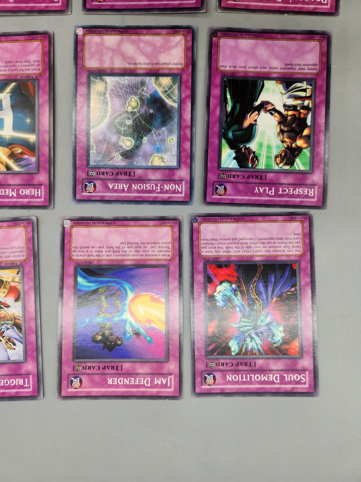 Up for sale is a lot of 9 authentic Yu-Gi-Oh! Trap...