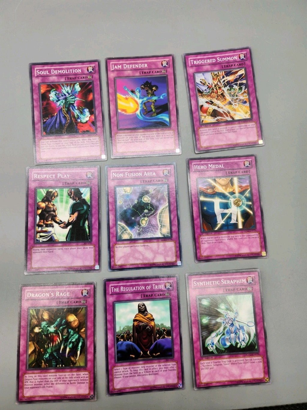 Up for sale is a lot of 9 authentic Yu-Gi-Oh! Trap...