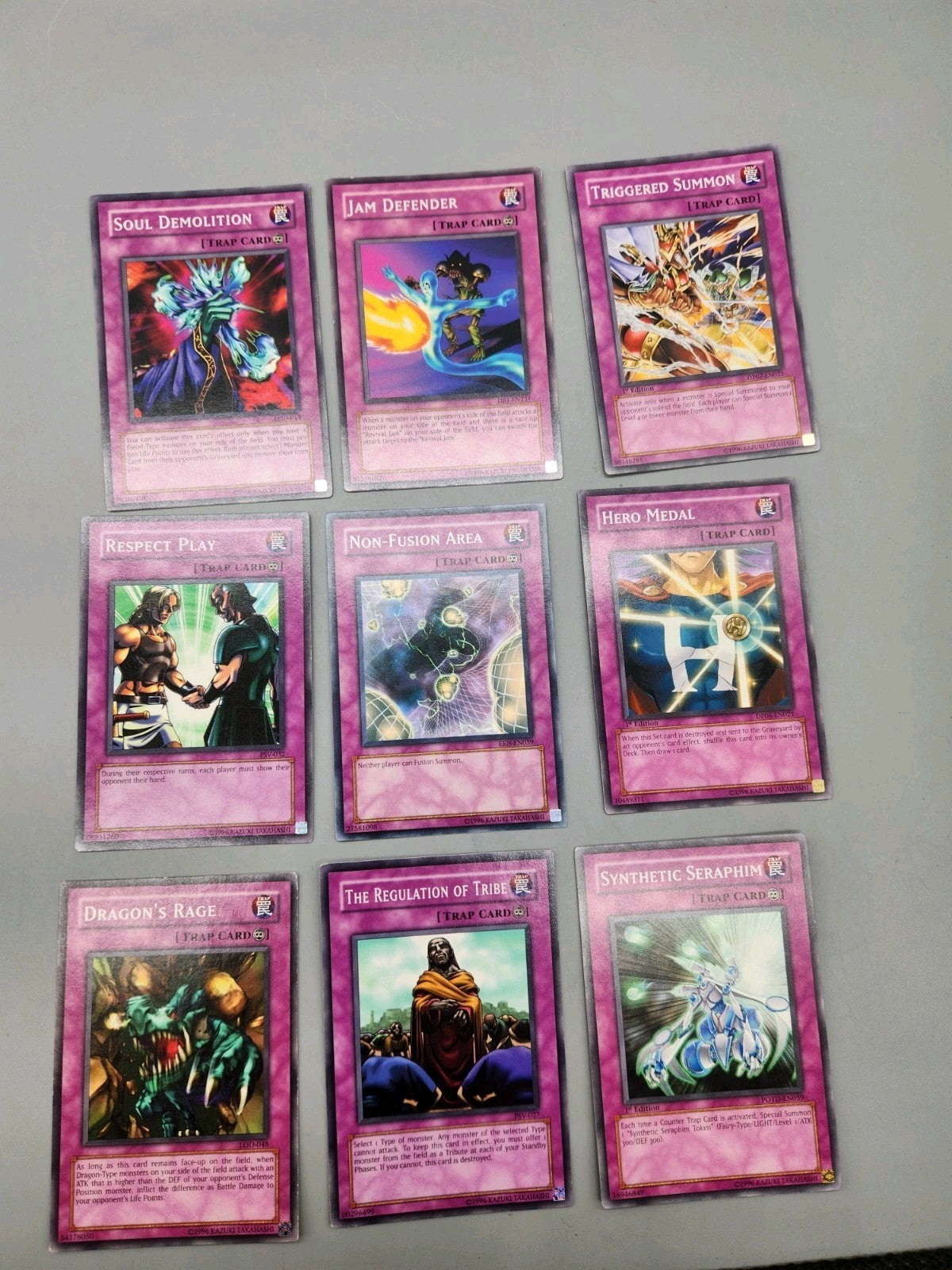 Up for sale is a lot of 9 authentic Yu-Gi-Oh! Trap...
