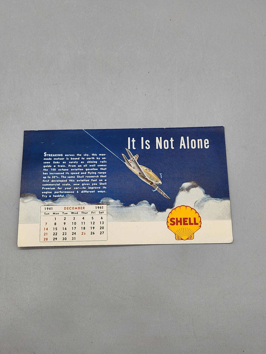 Vintage 1941 Shell It Is Not Alone Calendar Advertising Sign Blue Gas Oil Plane